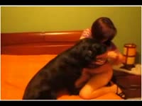 Fuck-hungry woman with huge tits enjoys playing with her dog